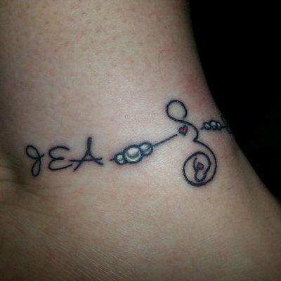 Tattoo celebrating being a mom to my wonderful son!!!