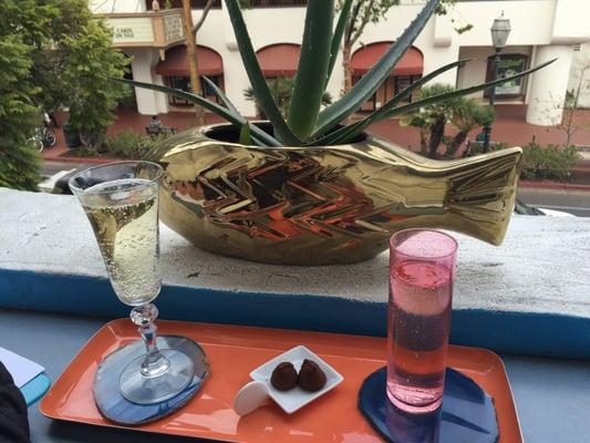 Champagne and truffles on the balcony overlooking State St.