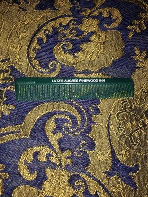 Still use it everyday! Most places have the cheapest complimentary toiletries, but this comb is standing the test of time.