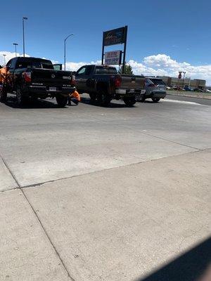 Sign & Cars lined up for interior cleaning