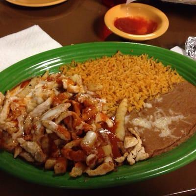 Pollo Tampatio - chicken, french fries smothered in red sauce & melted cheese. Delicious!!