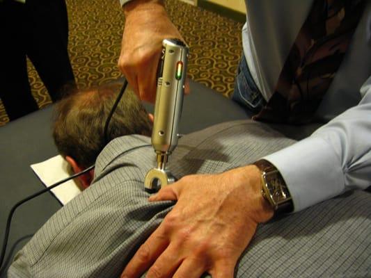 Spinal adjustment using IQ instrument from GOIMPULSE.COM