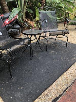 Side patio where they cut a palm tree down and left all the shavings from the tree all over instead of sweeping it up