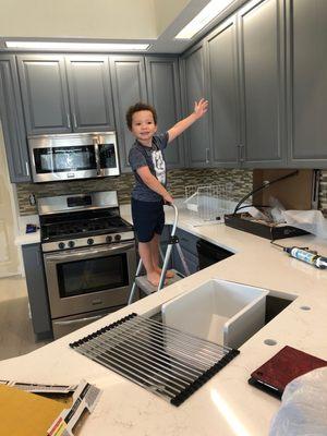 Showing off our renewed kitchen cabinets.
