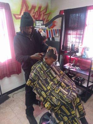 Jerry doing what he does best. The best barber in Elgin.