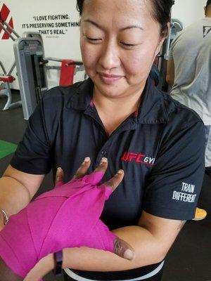 Getting hands wrapped for the boxing class is a must