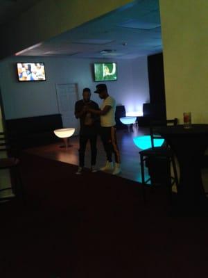 U walk into a building, up the stairs through a corridor and get greeted by music and neon tables?