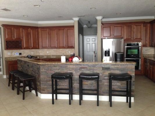 Design Magnifique designed and installed the slate around the kitchen island.