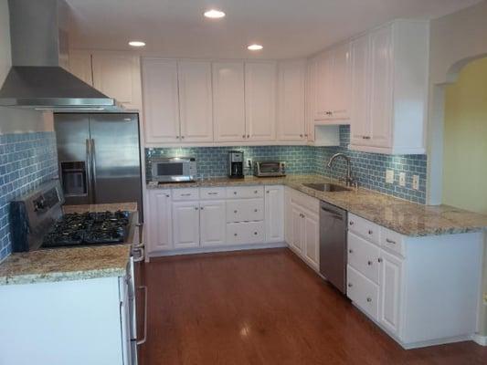 Complete kitchen remodel, flooring, refinished cabinets, granite tops, tile and painting.
