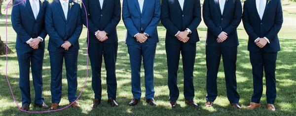 Groomsmen on the left were sent the wrong color suit (as you can see, they don't match the other 4 suits -excluding the groom in the middle)