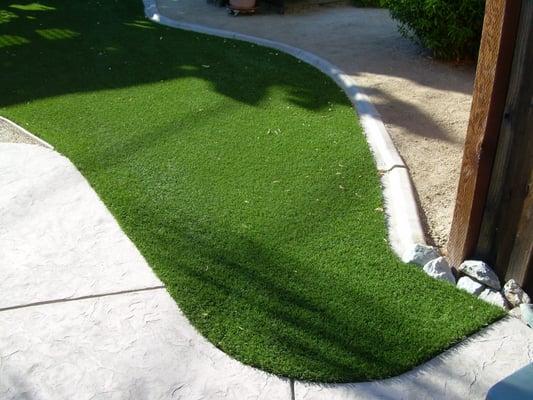 There is a flap in the turf, up near the concrete deck, to access the water shutoff valve that was under the lawn. Genius!!