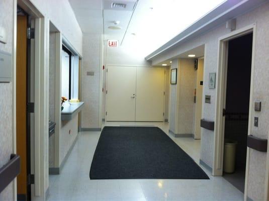 Lower level registration desk (across from elevators)