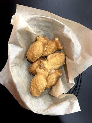 Fish-shaped buns that taste like pancakes and they can fill it with either Nutella or Bavarian cream.