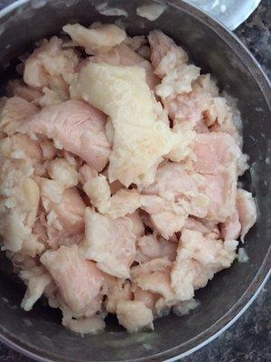 Chicken skin on top of canned chicken.