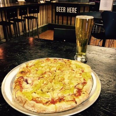 Gastronauts Hand tossed NY style pizza with artichoke hearts, pepperoncini and sliced red onion.