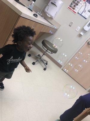 Laurie blowing bubbles to stop my son from crying. He wouldn't let her stop