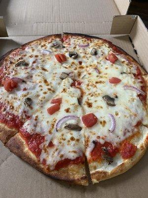 Mushroom, onion, spinach, tomatoes. Hardly any toppings