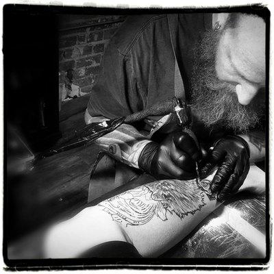 Samuel Goodwin working on my leg piece. Adding roses and filigree.