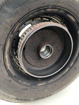 Back of wheel with brake drum still attached.
