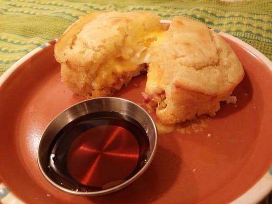 Homemade pancake sandwich with choice of bacon sausage. cheese and egg service with syrup or smothered