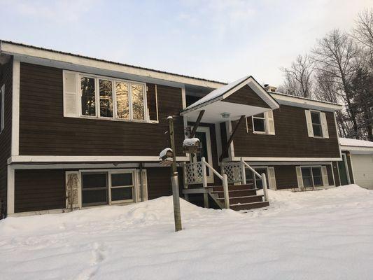 Small remodel job, tearing off old clap boards and adding vinyl to house