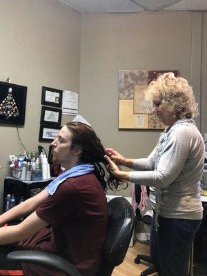 Judy getting the tangles out of Jacob's long hair.