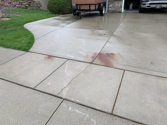Destroyed driveway and sidewalk. Rust stains, scraped, cracked, and crushed driveway and sidewalk!