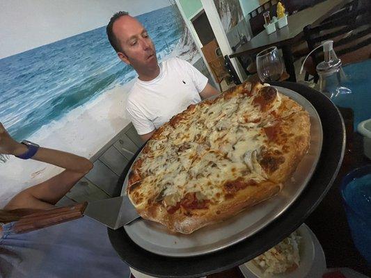 Pizza in front of COVID Ken