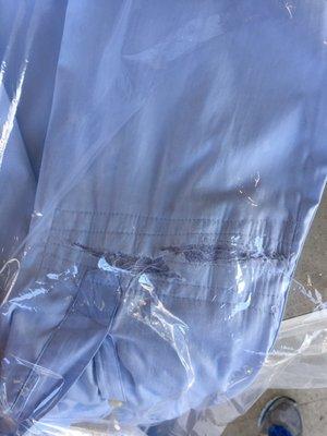 The shredded sleeve and attempted patch job.