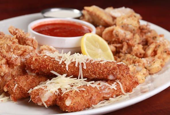 Appetizer sampler with calamari, ravioli, and mozzarella