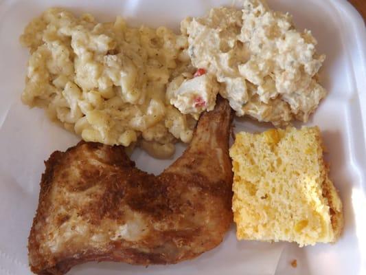 fried chicken meal with mac n cheese, potato salad, and cornbread
