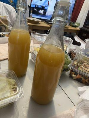 Specialty flavored liquor with fruit juice in a bottle These were flavored with Henney liquor