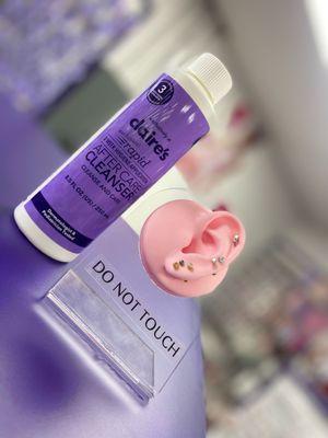 Aftercare solution and our various piercings.