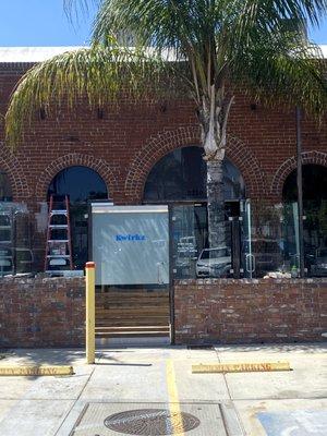 located in the back parking lot