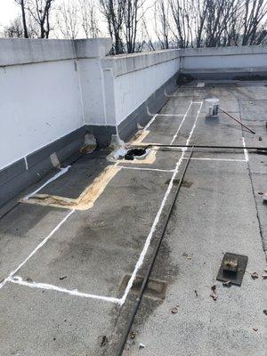 Power washed mud and debris off surfaces. Silicone sealant over concrete panel joints, counter flashing and cap sheet laps. Prep work done