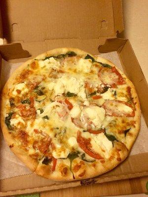 White pizza with spinach.