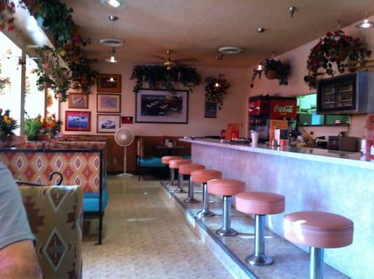 Quaint counter and booths.