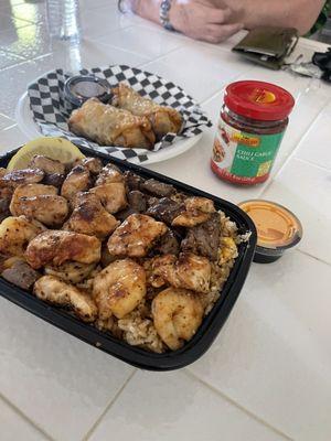 Trio with fried rice and veggies and egg rolls