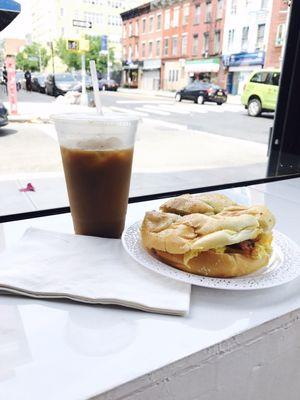 Sitting in the cutest vintage chairs looking towards the street.