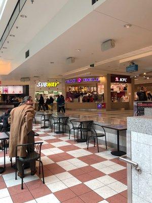 Taco Bell (front) also sells KFC: Kentucky Fried Chicken