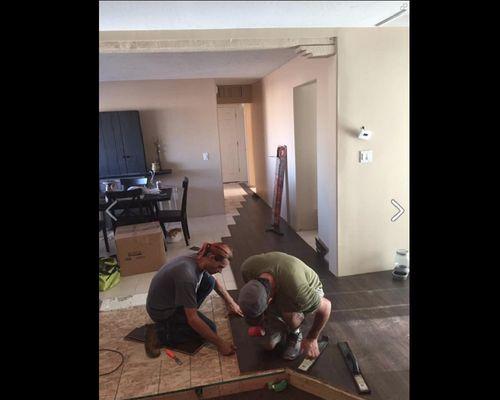 Installing wood flooring throughout