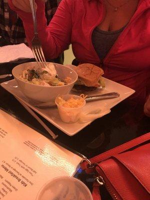 Burger with a side salad.