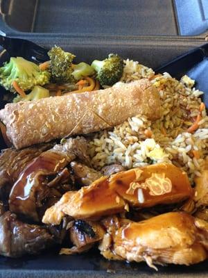 Chicken and steak teriyaki combo with an egg roll.