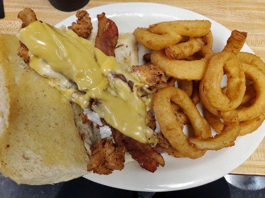 Bacon cheddar ranch sandwich with onion rings