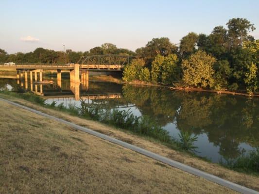 Trail along the Trinity Trail hat is overseen by a bridge and halted by a beaver dam