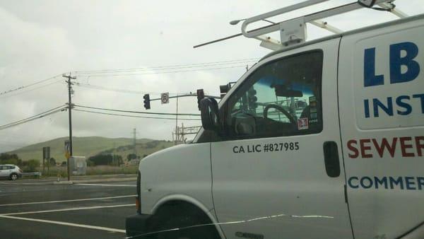 Yeah, thats a confederate flag with a picture of robert e lee in the drivers window on LB PLUMBINGs van.