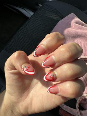 Full set of acrylics with cherry designs on 2 fingers each hand