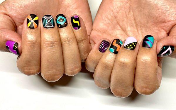 Colorful set inspired by Peruvian gourd designs. Get a similar look by booking a gel manicure or structured gel manicure + 60 mins of art.