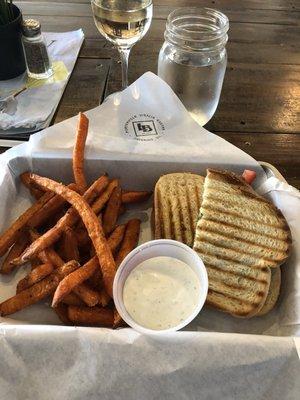 Caprese Panini with the best sweet potato fries I have ever had. Add a glass of Pinot Grigio and you have the perfect lunch. Great spot.