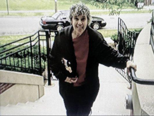 Rita Rinelli on the steps to the Kenosha Medical Center Cafeteria patio. .